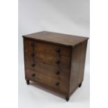 An early 19th century mahogany chest commode with lift top & mock drawer-fronts with turned knob