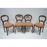 A set of four Victorian walnut “balloon-back “ dining chairs with pierced top-rails, padded