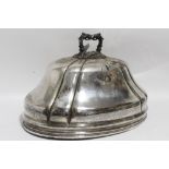 A 19th century large oval fluted domed dish cover with cast foliate ring handle & engraved armorial;
