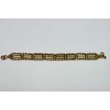 A 9ct. gold flexible bracelet of decorative gate-links. (w.a.f.).