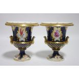 A pair of early 19th century Coalport porcelain campana shaped vases of deep blue ground with gilt