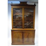 A 19th century mahogany & satinwood crossbanded tall bookcase in the late George III style, the