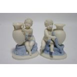 A pair of Royal Worcester pale blue & white parian posy vases, each modelled as a putto holding an