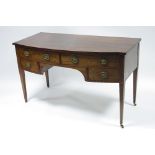 A George III style mahogany bow-front kneehole dressing table fitted two long & two short drawers