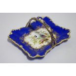 An early-mid 19th century English porcelain rectangular basket dish with over-hang handle, white &