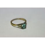 A 9ct gold ring set aquamarine (London 1950); a 9ct gold ring set three graduated garnets; five