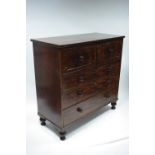 An early Victorian figured mahogany chest fitted four long graduated drawers with turned knob