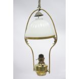 A Victorian brass pendant ceiling light with opaque white glass domed shade.