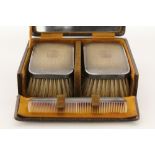 A pair of George V rectangular engine-turned hair brushes, & matching comb; Birmingham 1928, in