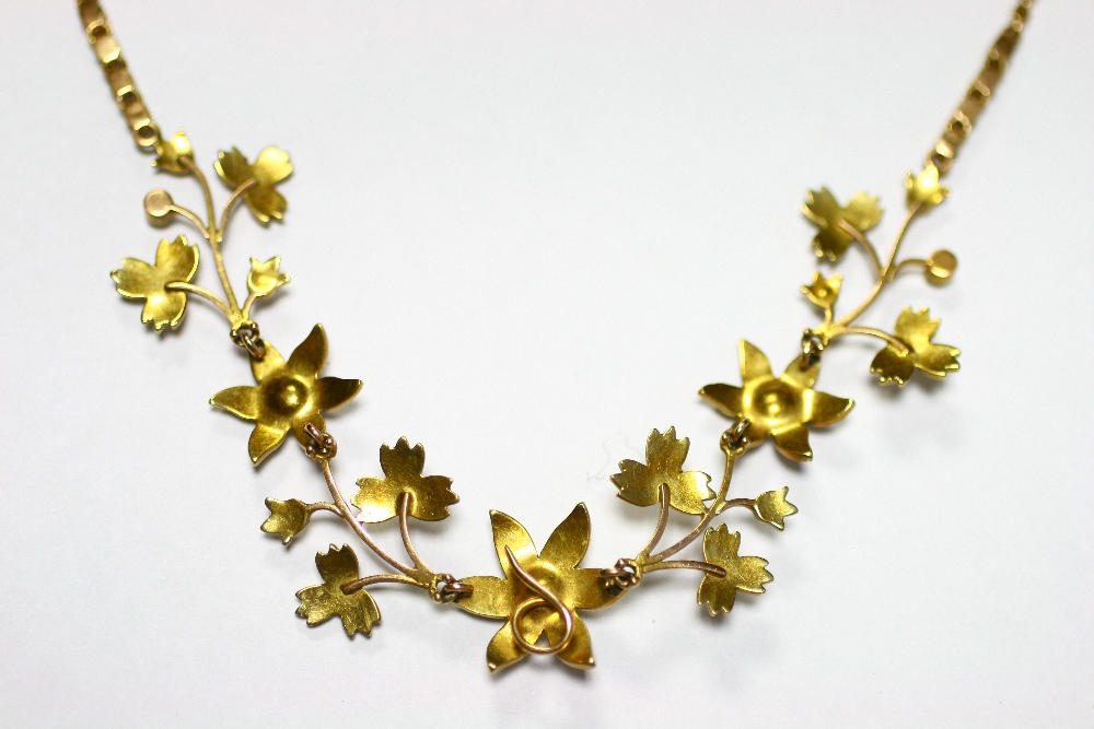 An early 20th century gold flower-design articulated necklace set seed pearls. - Image 2 of 2