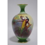 A Royal Worcester porcelain ovoid vase with short flared neck, the body painted with peacocks in