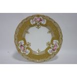 A fine quality Royal Crown Derby dessert plate, the wide border with reserves of pink roses