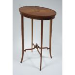 An Edwardian satinwood oval occasional table with radially veneered top centred by a marquetry sea-