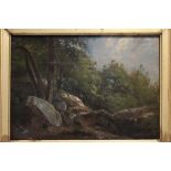 COURBET (attributed to).  A wooded landscape with boulders to the fore.  Oil on mahogany panel: