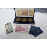 Three large bronze medals commemorating the Life of Bartolomeu Dias (cased); three 10/- notes; &