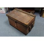 An early 20th century leather-covered wood travelling trunk with hinged lift-lid, and with leather