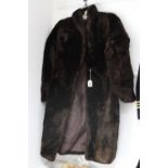 Two ladies’ fur coats; and a fox fur stole.
