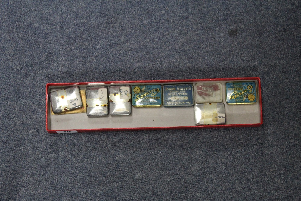 Nine tins of gramophone needles by H.M.V., Songster, etc.