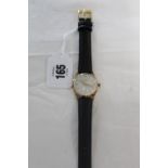 An Avia 15 jewel ladies’ wristwatch in 9ct gold case and with black leather strap, circa 1960s.