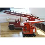 A red tinplate toy fire engine, 17½" long; a Tri-ang tinplate toy crane; and a “Hit-A-Pin” bagatelle