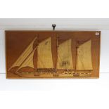 A wooden half-block picture depicting a sailing vessel, 18¼" x 36¼".