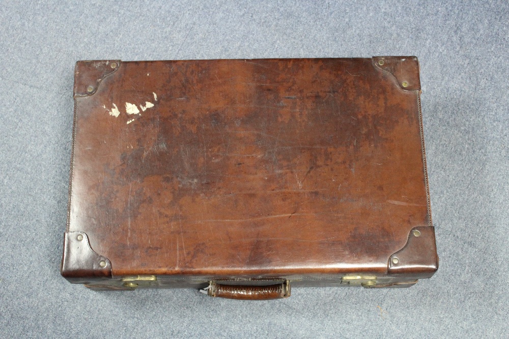 A late 19th/early 20th  century tan leather brass studded suitcase fitted brass twin-lever locks, - Image 2 of 2