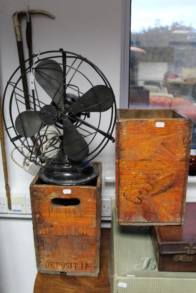 A G.E.C. electric desk fan in black painted metal case; together with a pair of Corona Fruit