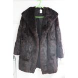 A rabbit fur silk-lined ladies’ coat.