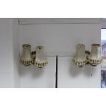 A pair of brass & ceramic twin-branch wall lights, with shades, 8½" x 5".