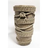 A late 19th century continental earthenware cylindrical stick stand in the form of a rope-bound