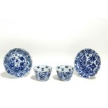 A pair of Chinese Kang Hsi period blue & white porcelain teabowls & saucers, the moulded petal-
