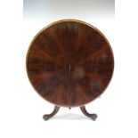 A MID-VICTORIAN FIGURED MAHOGANY CIRCULAR DINING TABLE with radially veneered tilt top, on heavy