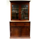 An early Victorian mahogany secretaire bookcase fitted three adjustable shelves enclosed by a pair