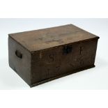 An 18th century oak rectangular storage box with hinged lid, the front with carved initials S.