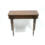A regency mahogany tea table, the rectangular fold-over top with rounded corners & reeded edge,