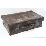 16. An early 20th century tan leather suitcase, fitted chrome twin-lever locks, 27” x 17½” x 8”.