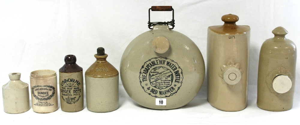 10. An old Fulham Pottery “Adaptable Hot Water Bottle & Bed Warmer”, 10” diam.; together with two