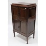 38. An Edwardian mahogany floor-standing gramophone cabinet (lacking fittings), enclosed by hinged
