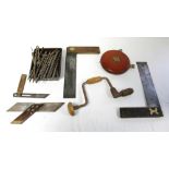 4. Two brass inlaid mahogany set squares, together with various other tools; & a Rabone