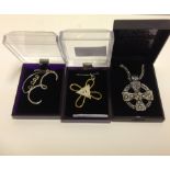 Two boxed Reiki pendents and a boxed Cel