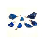 Seven Lapis Lazuli pendent pieces.