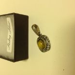 A 925 Silver Amber pendant, set into a s