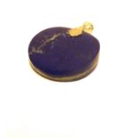 A circular Lapis Lazuli pendant. 4cm.