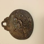 A Greek letter clip with an owl on one s