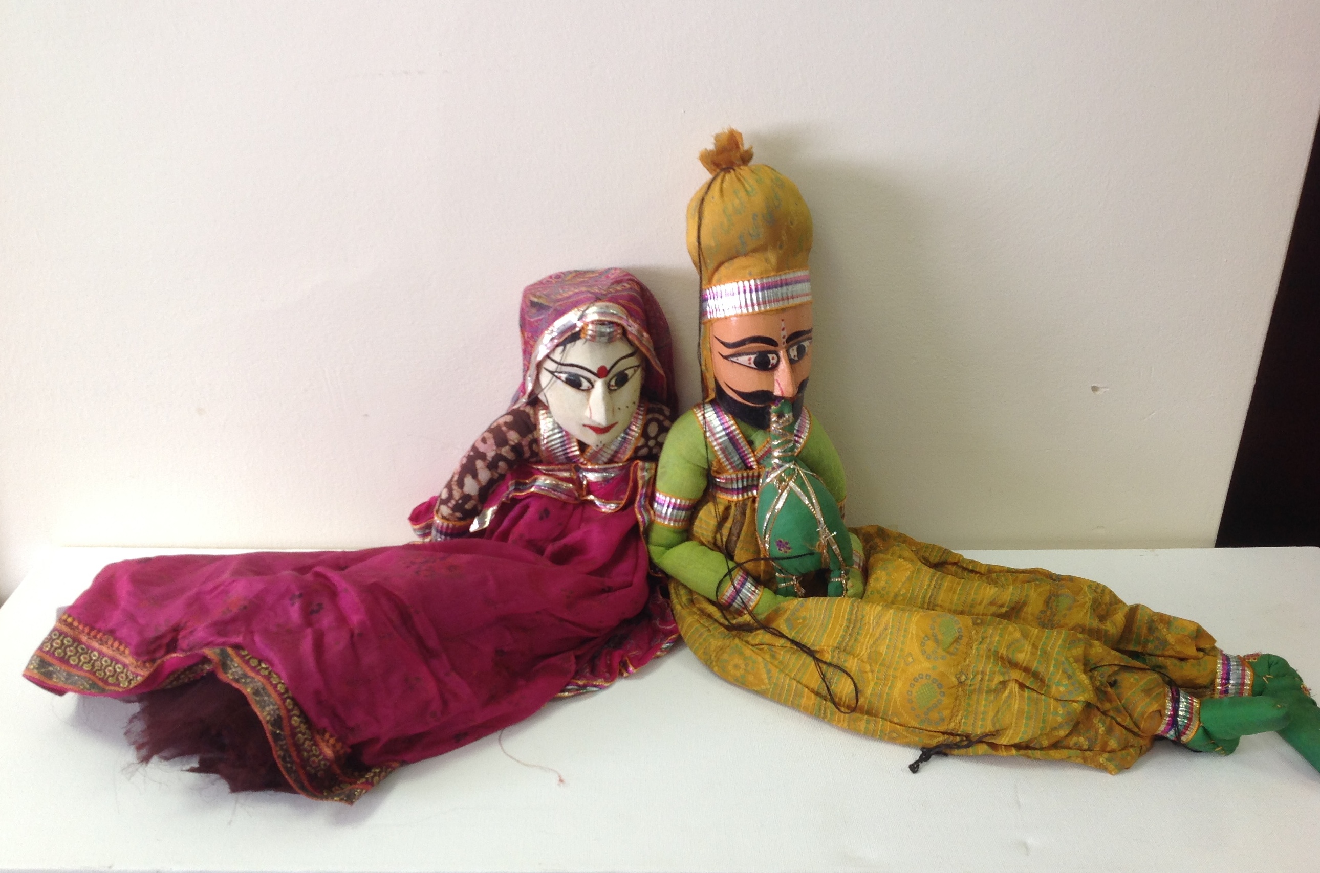 2 handmade carved Indian puppets in cere