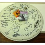 A drum skin autographed by Glenn Hughes