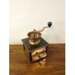 A copper coffee grinder