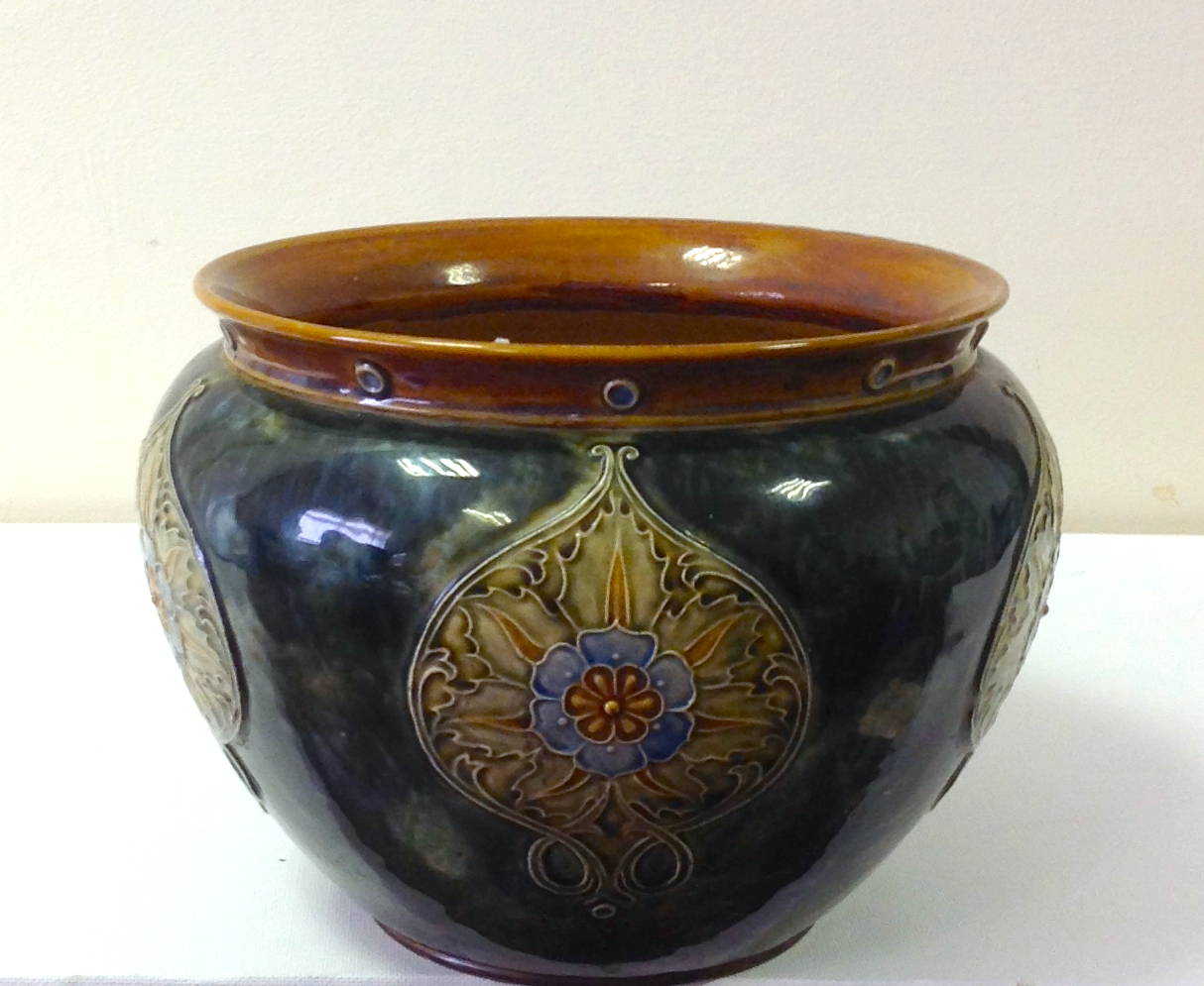 A Royal Doulton Jardiniere decorated in