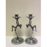 A pair of female form candle sticks. H18