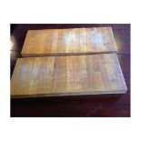 A pair of wooden chopping boards.